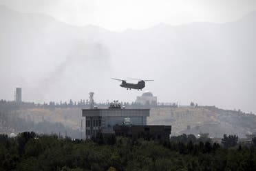 In this Sunday, Aug. 15, 2021 file photo, a US Chinook helicopter flies over the US embassy in Kabul, Afghanistan. (AP)