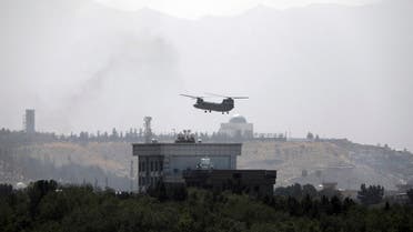 In this Sunday, Aug. 15, 2021 file photo, a US Chinook helicopter flies over the US embassy in Kabul, Afghanistan. (AP)