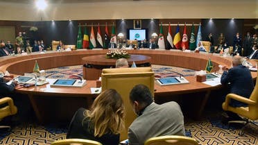 Officials attend a meeting by Libya’s neighbors as part of international efforts to reach a political settlement to the country’s conflict, in the Algerian capital Algiers, on August 30, 2021. (Ryad Kramdi/AFP)