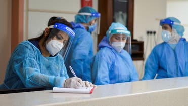 Medical staff members wearing protective gear work at a section for patients suffering from the coronavirus disease (COVID-19), inside a hospital in Amman, Jordan March 23, 2021. Picture taken March 23, 2021. (File photo: Reuters)