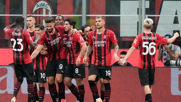 AC Milan's Olivier Giroud, celebrates with his teammates after scoring his side's fourth goal from the penalty spot during a Serie A soccer match between AC Milan and Cagliari, at the San Siro stadium in Milan, Italy, on Aug. 30, 2021. (AP)