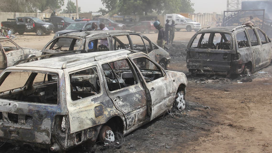 In this photograph taken in Auno on February 10, 2020, cars burnt down by suspected members of the Islamic State West Africa Province (ISWAP) during an attack on February 9, 2020, is seen. Jihadists killed at least 30 people and abducted women and children in a raid in northeast Nigeria's restive Borno state, a regional government spokesman said on February 10, 2020.