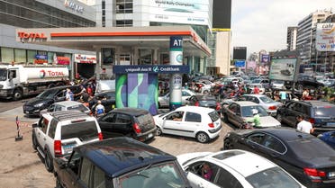 FILE PHOTO: People wait in cars to get fuel at a gas station in Zalka, Lebanon, August 20, 2021. REUTERS/Mohamed Azakir/File Photo