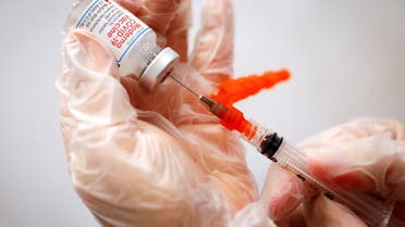 A healthcare worker prepares a syringe with the Moderna COVID-19 Vaccine at a pop-up vaccination site operated by SOMOS Community Care during the COVID-19 pandemic in Manhattan in New York City, New York, US, January 29, 2021. (Reuters)