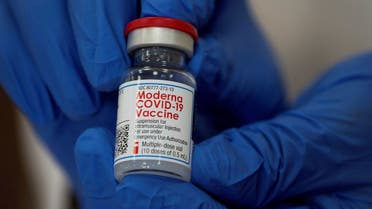 FILE PHOTO: FILE PHOTO: An employee shows the Moderna COVID-19 vaccine at Northwell Health's Long Island Jewish Valley Stream hospital in New York, U.S., December 21, 2020. REUTERS/Eduardo Munoz/File Photo
