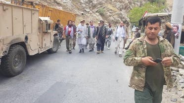 Anti-Taliban commanders walk on a road in Panjshir Valley, Afghanistan August 23, 2021.  (Reuters)
