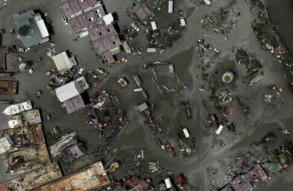 In this drone image released by NOAA, flood waters cover Tom's Marine & Salvage in Barataria, La., following the aftermath of Hurricane Ida. (NOAA via AP)