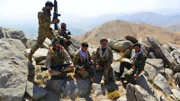 Afghan resistance movement and anti-Taliban uprising forces take rest as they patrol on a hilltop in Darband area in Anaba district, Panjshir province on September 1, 2021. Panjshir -- famous for its natural defences never penetrated by Soviet forces or the Taliban in earlier conflicts -- remains the last major holdout of anti-Taliban forces led by Ahmad Massoud, son of the famed Mujahideen leader Ahmed Shah Massoud.