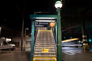 A sign on stairs to the 25th Avenue stop on the D subway line indicates that the subway system is closed overnight for cleaning during the coronavirus pandemic, Wednesday, May 13, 2020, in the Brooklyn borough of New York. (AP)