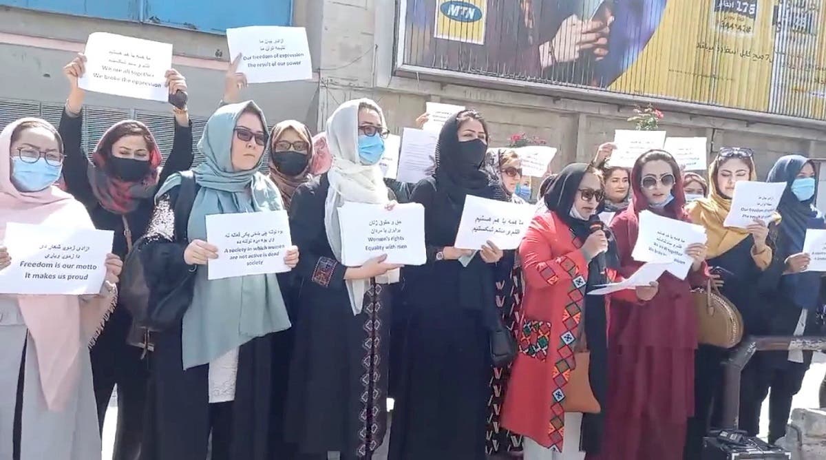 Women hold placards as they protest in Kabul, Afghanistan, on September 3, 2021 in this still image obtained from a social media video. (Reuters)