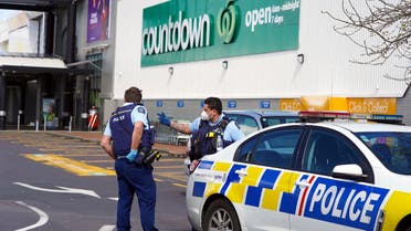 Police keep watch outside the Countdown supermarket at Lynn Mall in Auckland on September 4, 2021, the day after an IS-inspired attacker injured six people in a knife rampage before being shot dead by undercover police. (AFP)