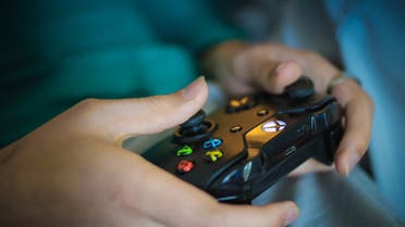 A stock image depicting a person playing a video game. (Pixabay)