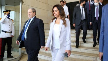 Syrian Foreign Minister Faisal al Mekdad, walks with Lebanon's caretaker Foreign Minister and Defense Zeina Akkar after their meeting in Damascus, Syria September 4, 2021.  (Reuters)