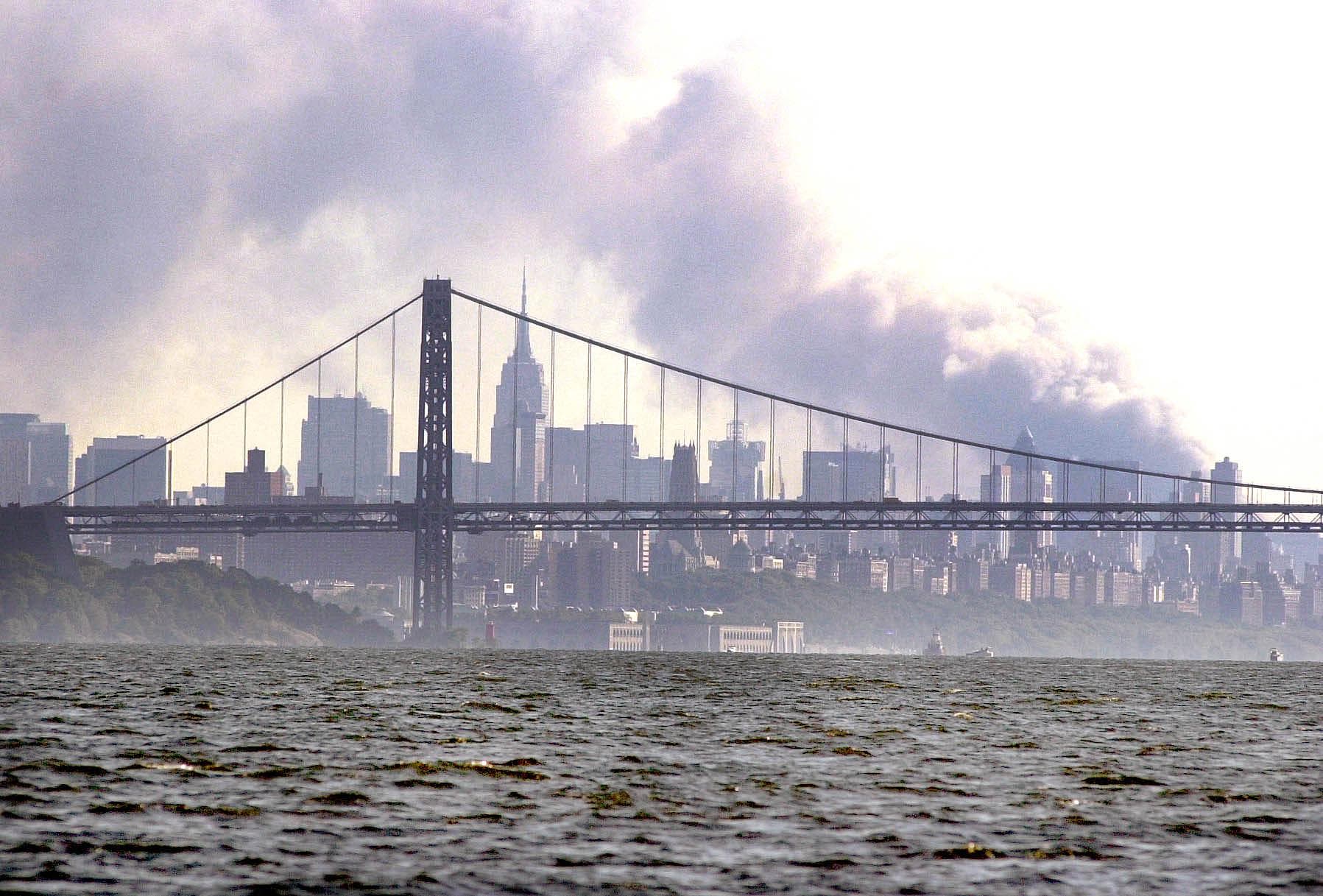 Smoke rises from the New York skyline 11 September 2001 after two hijacked planes crashed into the landmark World Trade Center. (AFP)