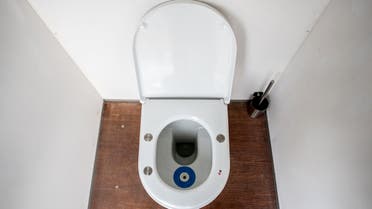 A picture taken on August 16, 2019 shows a Smart Toilet on the site of the music festival 'Lowlands Paradise' in Biddinghuizen, The Netherlands. The 'Smart Toilet' measures a number of health aspects: urine, heart rate and blood pressure. Based on the results, the toilet provides an adjusted nutritional advice for festival goers. (AFP)