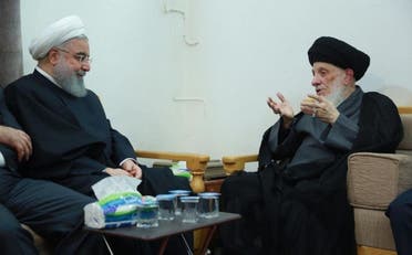 الرئيس الإيراني السابق حسن روحاني أثناء زيارته المرجع الراحل محمد سعيد الحكيم