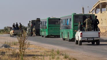 Buses carrying rebels and their families are seen in Deraa, Syria, in this handout released by SANA on August 26, 2021. SANA/Handout via REUTERS ATTENTION EDITORS - THIS IMAGE WAS PROVIDED BY A THIRD PARTY. REUTERS IS UNABLE TO INDEPENDENTLY VERIFY THIS IMAGE.