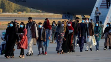 Afghan citizens, who have been evacuated from Kabul, disembark from a U.S Air Force transport plane as they arrive at Naval Station (NAVSTA) Rota Air Base in Rota, southern Spain, August 31, 2021. REUTERS/Jon Nazca