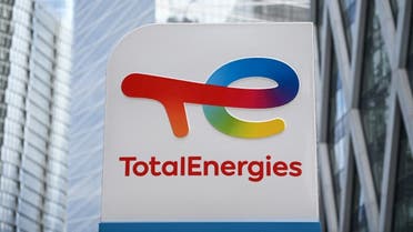 This photograph taken on May 28, 2021 shows the new TotalEnergies logo during its unveling ceremony, at a charging station in La Defense on the outskirts of Paris. (AFP)
