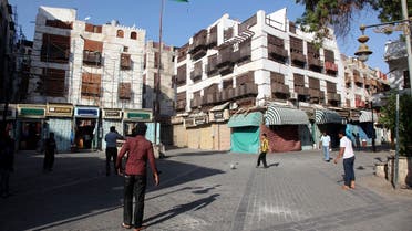 People play football in Jeddah's historic district January 1,2013. In the heart of Saudi Arabia's sprawling Red Sea port city of Jeddah, centuries-old buildings tilt and buckle above the historic district's narrow alleys, withering away in the absence of decisive action to protect them. (Reuters)