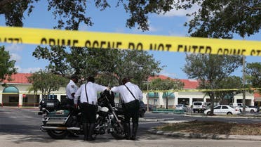 Palm Beach County Sheriff’s officers stand outside of a Publix supermarket where a woman, child and a man were found shot to death on June 10, 2021 in Royal Palm Beach, Florida. (File photo: AFP)