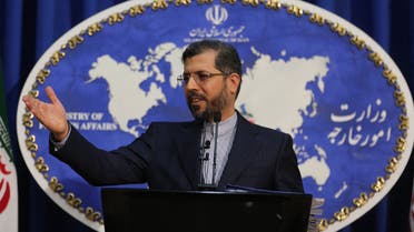 Iranian foreign ministry spokesman Saied Khatibzadeh gestures during a press conference in Tehran on February 22, 2021. Iran hailed as a significant achievement a temporary agreement Tehran reached with the head of the UN nuclear watchdog on site inspections. That deal effectively bought time as the United States, European powers and Tehran try to salvage the 2015 nuclear agreement that has been on the brink of collapse since Donald Trump withdrew from it.