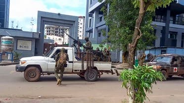 In this image made from video, unidentified soldiers patrol in a vehicle near the office of the president in the capital Conakry, Guinea, on Sept. 5, 2021. (AP)