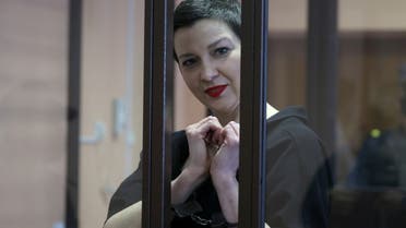 Belarusian opposition politician Maria Kolesnikova, charged with extremism and trying to seize power illegally, gestures inside a defendants' cage as she attends a court hearing in Minsk, Belarus September 6, 2021. (Reuters)