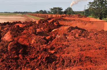 A train loaded with bauxite arrives at the bauxite factory of Guinea's largest mining firm, Compagnie des Bauxites de Guinee (CBG), at Kamsar, a town north of the capital Conakry, on October 23, 2008. (AFP)