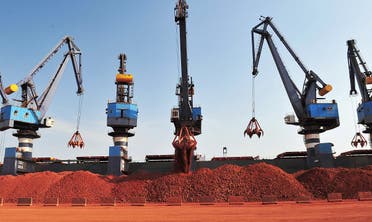 A ship carrying bauxite from Guinea is unloaded at a port in Yantai, Shandong province, China May 15, 2017. (Reuters/Stringer)