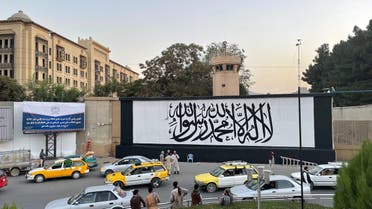 A giant Taliban flag painted over the entrance of the former US Embassy building in Afghanistan’s capital Kabul. (Twitter)