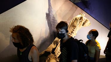 Students from Salem, Oregon walk past a piece of wreckage preserved from the Twin Towers of the World Trade Center during a tour of the 9/11 Tribute Museum in New York City, US. (Reuters)
