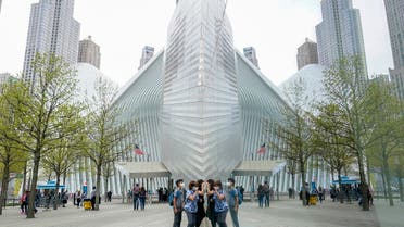 Visitors peek into the museum at the 9/11 Museum & Memorial, April 29, 2021. (AP)