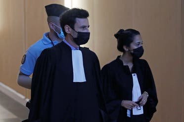 Olivia Ronen and Martin Vettes, lawyers of Salah Abdeslam, one of the accused, who is widely believed to be the only surviving member of the group suspected of carried out the attacks, arrive for the start of the trial of the Paris' November 2015 attacks at the Paris courthouse on the Ile de la Cite, in Paris, France, September 8, 2021. (Reuters)