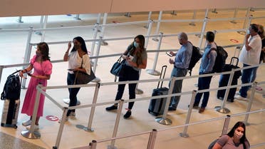 Travelers wait to clear the security check point at Love Field airport in Dallas. (File photo: AP)