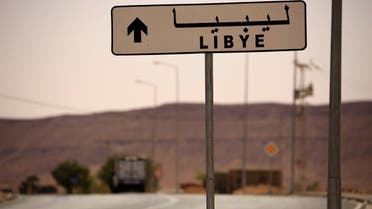 A road sign shows the direction of Libya near the border crossing at Dhiba, Tunisia. (File Photo: Reuters)
