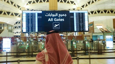 A Saudi man checks the flight timings at the King Khalid International Airport, after Saudi authorities lifted the travel ban on its citizens after fourteen months due to coronavirus disease (COVID-19) restrictions, in Riyadh, Saudi Arabia, May 16, 2021. (Reuters)