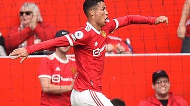 Manchester United's Portuguese striker Cristiano Ronaldo celebrates after scoring the opening goal of the English Premier League football match between Manchester United and Newcastle at Old Trafford in Manchester, north west England, on September 11, 2021. (AFP)