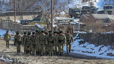 Azeri soldiers walk near their military vehicles at the Kalbajar district, Azerbaijan, December 21, 2020. Picture taken December 21, 2020. (File photo: Reuters)
