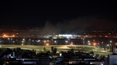 Smoke rises over the Erbil, after reports of mortar shells landing near Erbil airport, Iraq February 15, 2021. (Reuters)