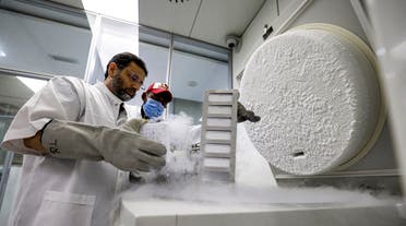 Dr. Nisar Ahmad Wani, Scientific Director of the Reproductive Biotechnology Center, checks on frozen samples at the centre's laboratory in Dubai on June 4, 2021. (AFP)