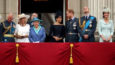 Britain's Queen Elizabeth is joined by members of the Royal Family on the balcony of Buckingham Palace as they watch a fly past to mark the centenary of the Royal Air Force in central London. (Reuters)