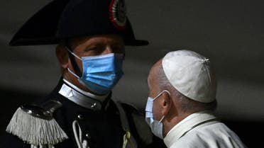 Pope Francis salutes a Carabiniere as he boards a plane for Budapest and Slovakia on September 12, 2021 at Rome’s Fiumicino international airport. (AFP)