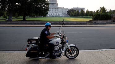 A US Capitol Police officer patrols around the US Capitol in Washington, DC, US September 13, 2021. (Reuters/Jonathan Ernst)