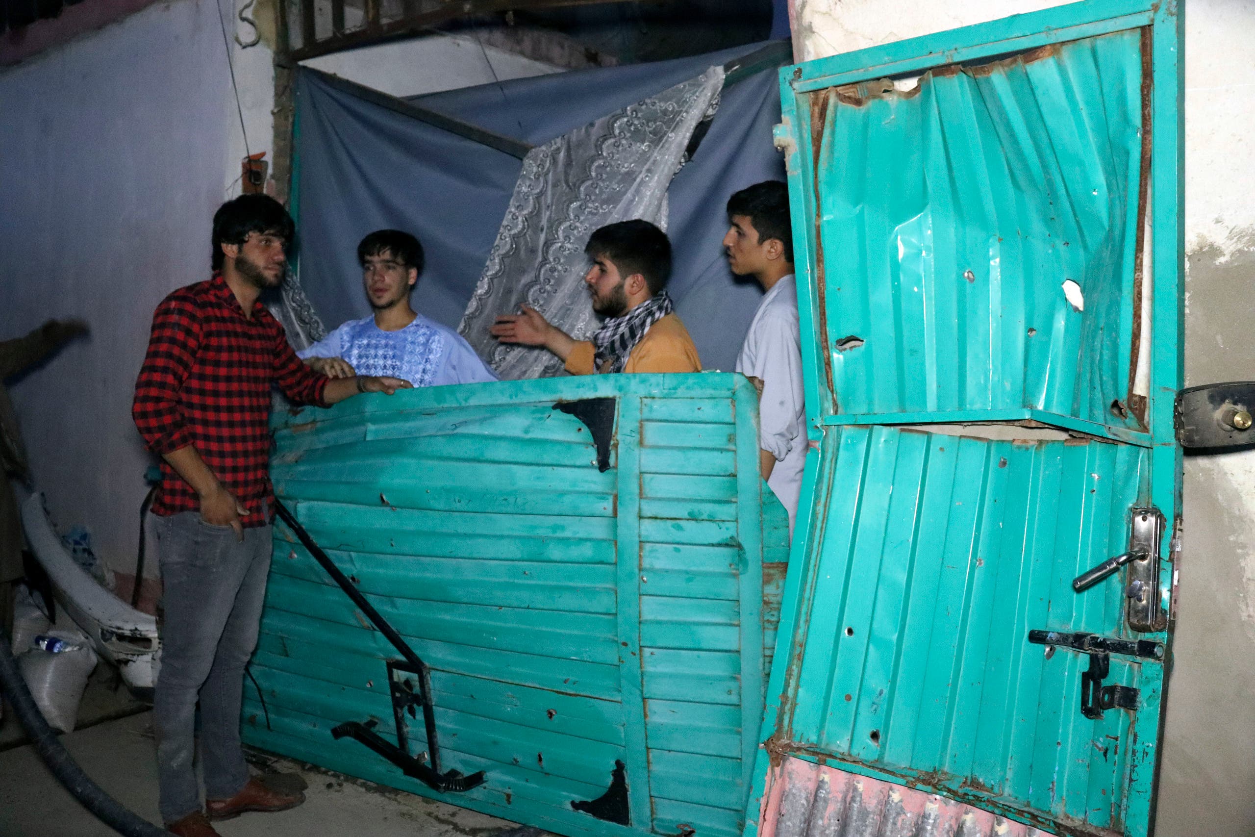 In this Sunday, Aug. 29, 2021 file photo, Afghans inspect damage of Ahmadi family house after U.S. drone strike in Kabul, Afghanistan, Sunday, Aug. 29, 2021. (File photo: AP)