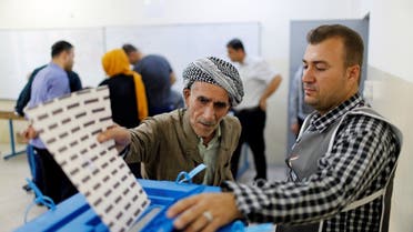 An elderly Kurdish man casts his vote at a polling station, during parliamentary elections in the semi-autonomous region in Erbil. (Reuters)