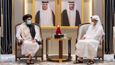 This handout picture provided by Qatar's Ministry of Foreign Affairs on August 17, 2021 shows Qatari Foreign Minister Sheikh Mohammed bin Abdulrahman Al-Thani (R) meeting with the Taliban's political office chief Mullah Abdul Ghani Baradar in Doha.  (AFP)
