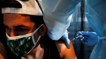 A man is inoculated against the coronavirus disease (COVID-19) during a vaccination event hosted by Miami-Dade County and Miami Heat, at FTX Arena in Miami, Florida, U.S., August 5, 2021. (File photo: Reuters)