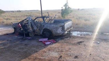A handout picture released by the Hashed al-Shaabi force shows the wreckage of a vehicle at the site of an unclaimed drone attack near Iraq's western border with Syria on August 25, 2019. (File photo: AFP)