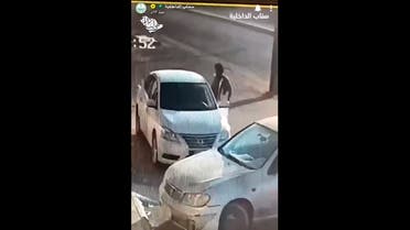 Screengrab of a video that shows a man steeling a car from al-Qassim. (Screengrab)